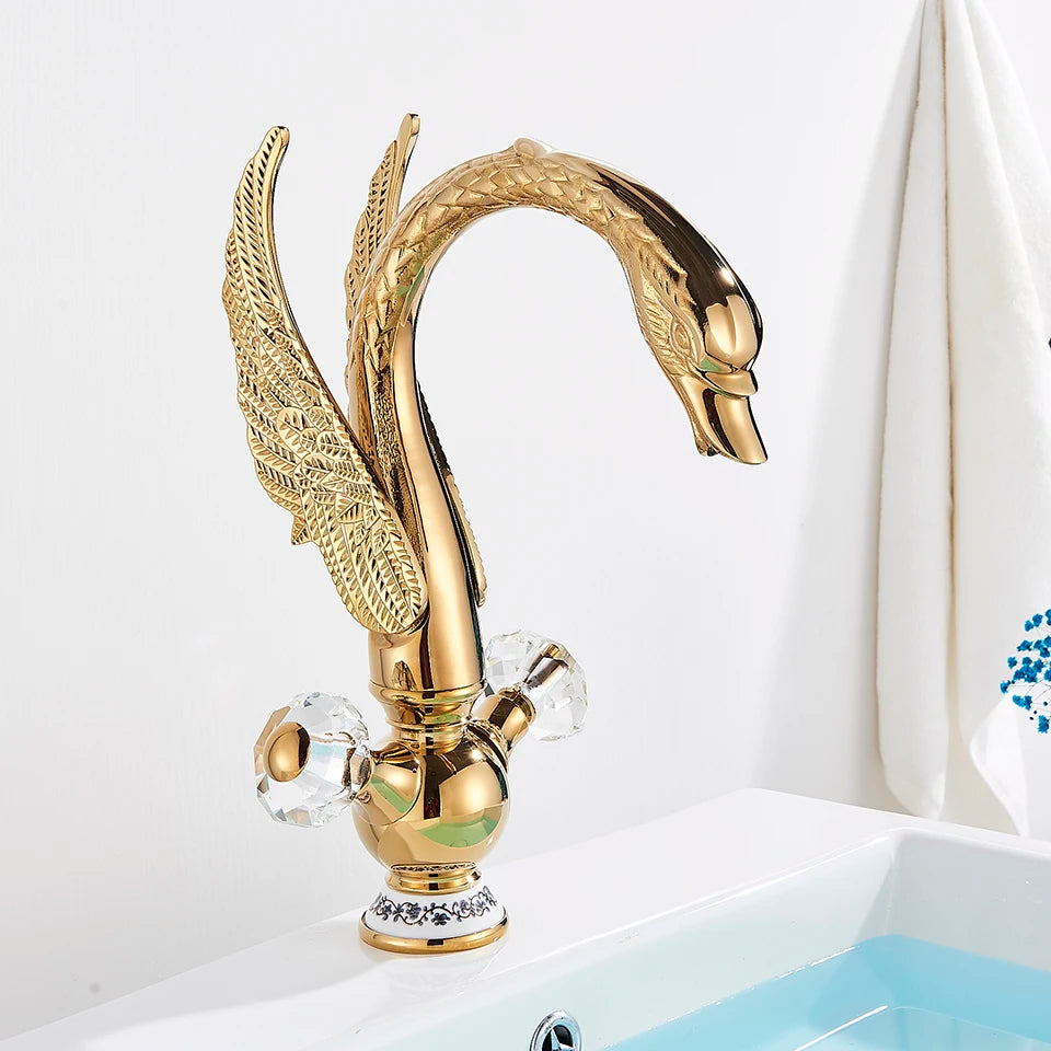 Gold Swan Single-Hole Basin Faucet, with two crystal handles over a white basin