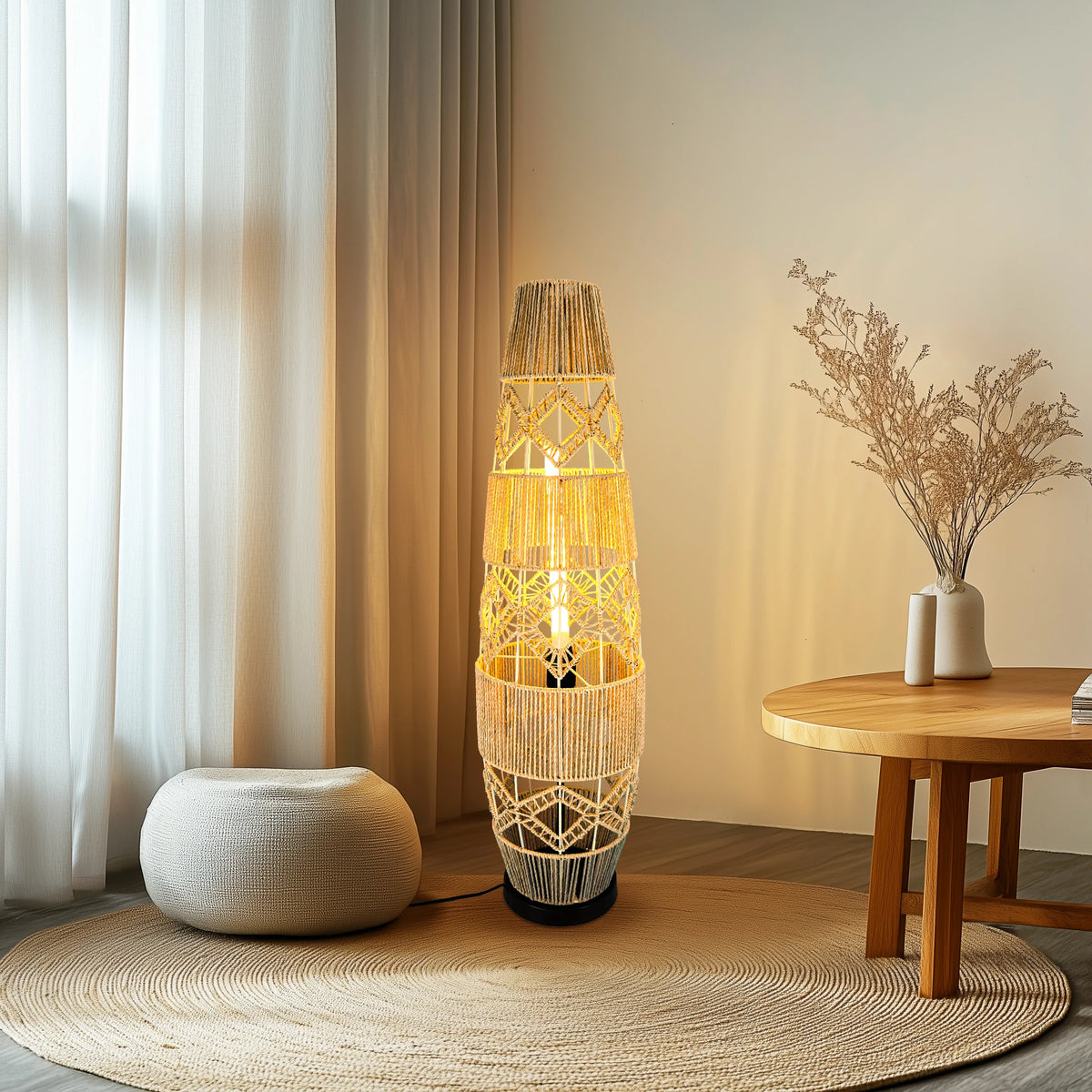 Tall cane floor lamp next to a pouf and side table