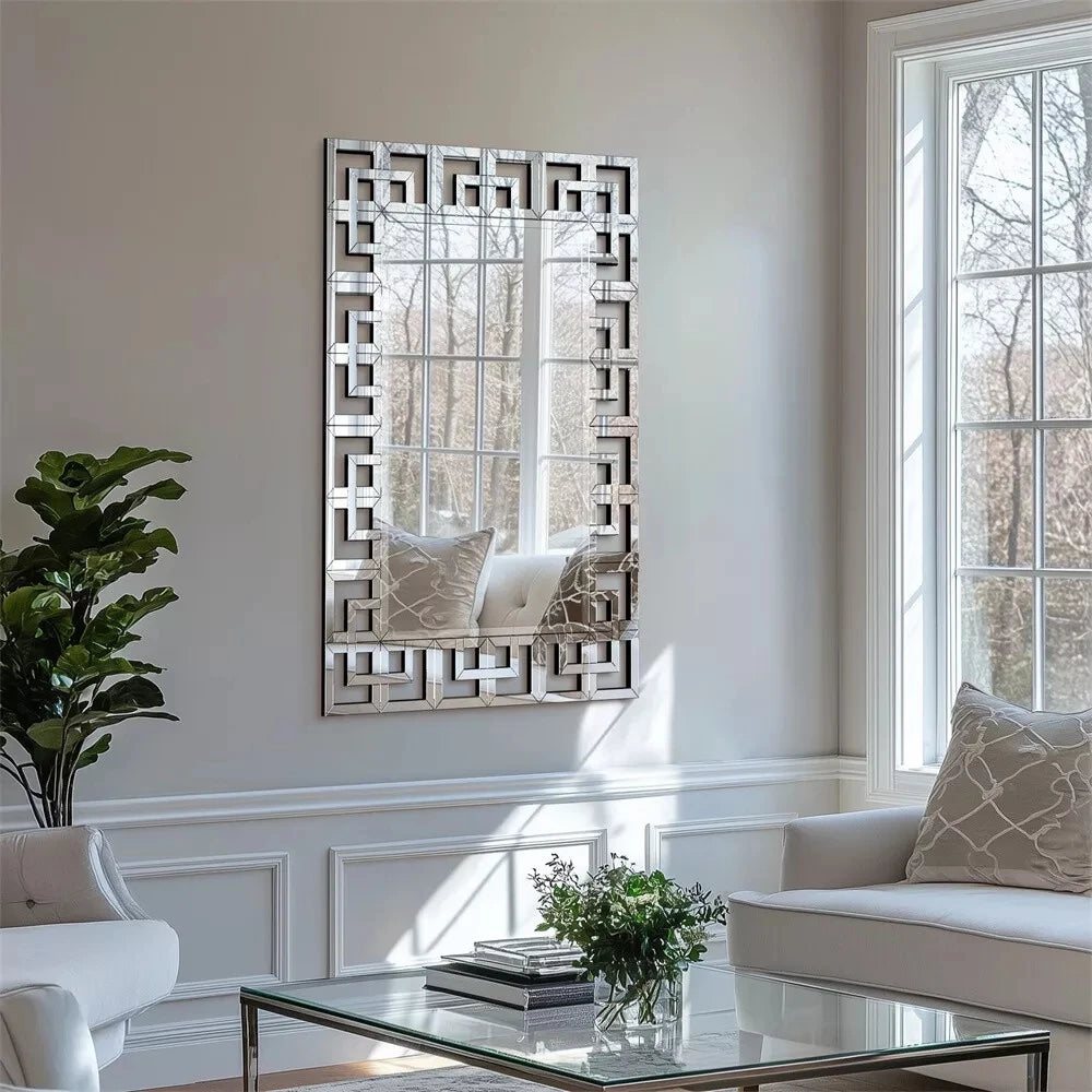 Vertical Greek-key Venetian mirrored glass wall mirror in a bright living room