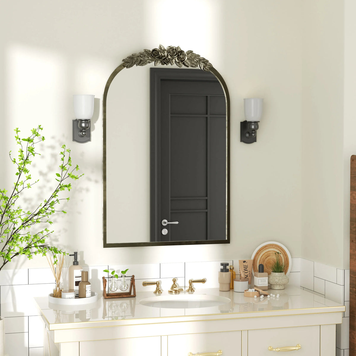Antique silver baroque arched mirror in a white bathroom