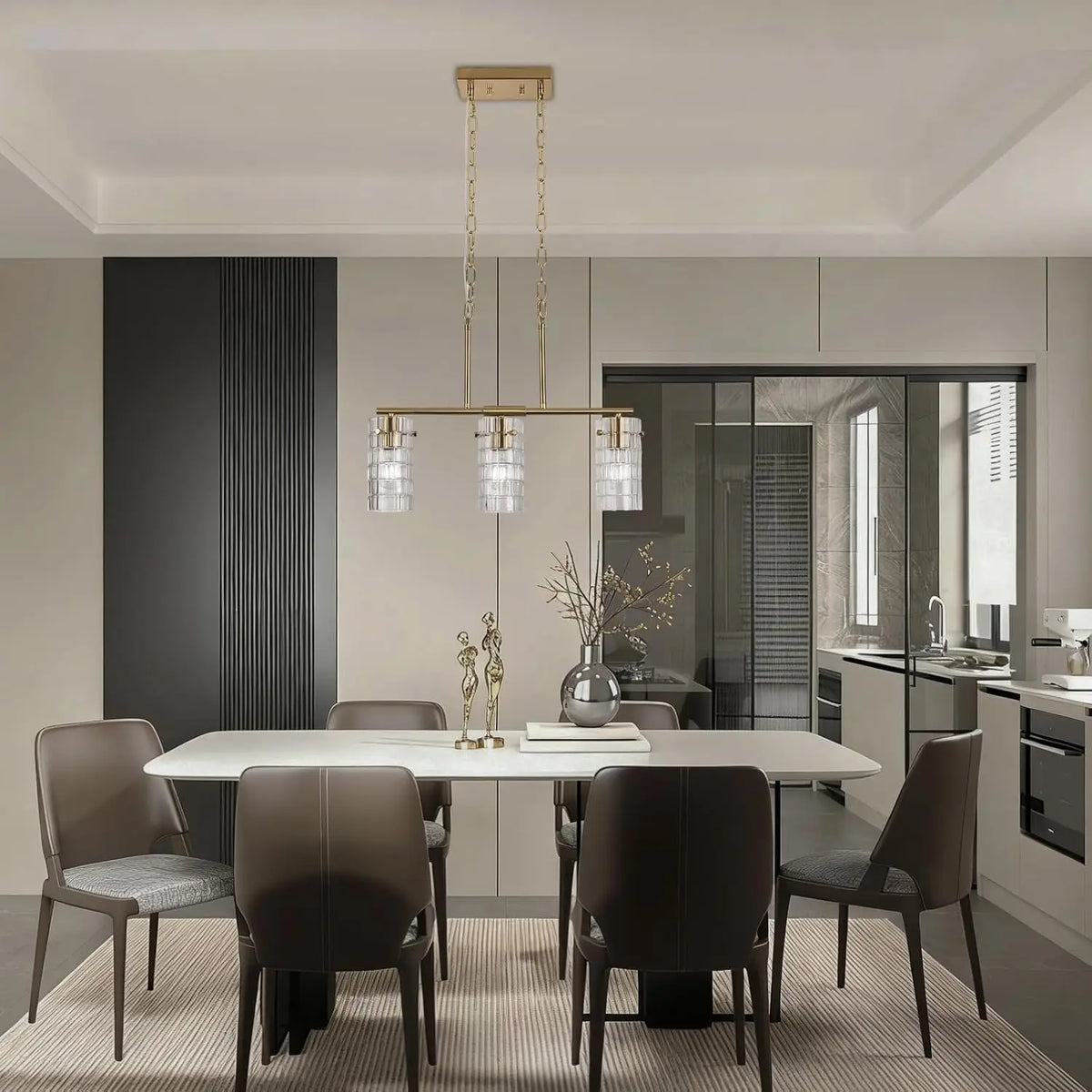 Brass three-light linear pendant with clear glass shades in a dining room