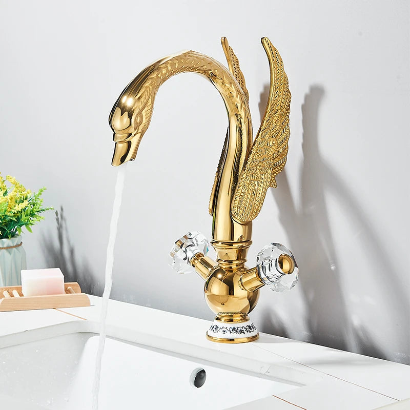 Gold swan-neck faucet installed on a white vessel sink