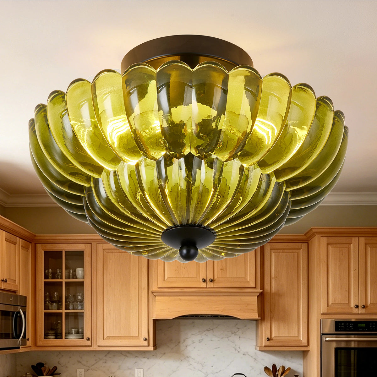 Green petal glass semi-flush ceiling light over a kitchen