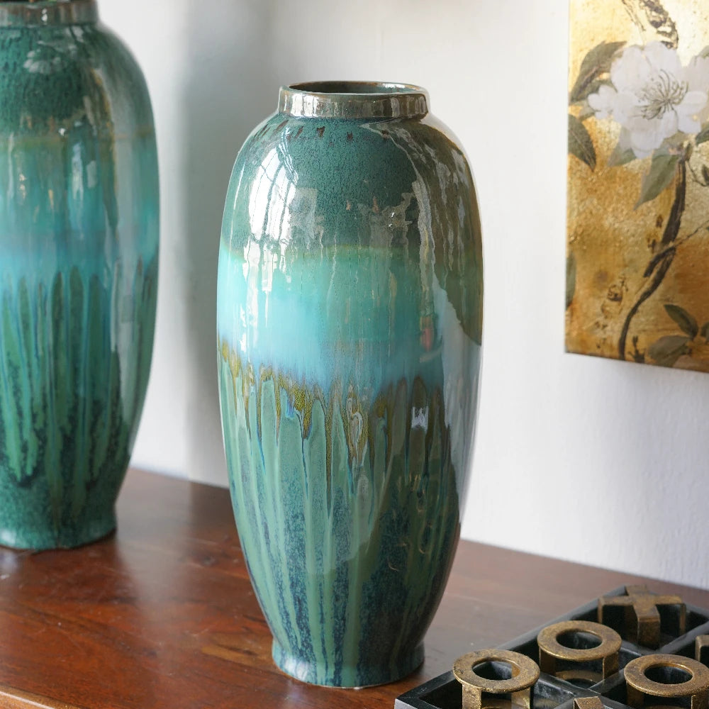 Close view of the teal-to-blue drip glaze on the ceramic vase