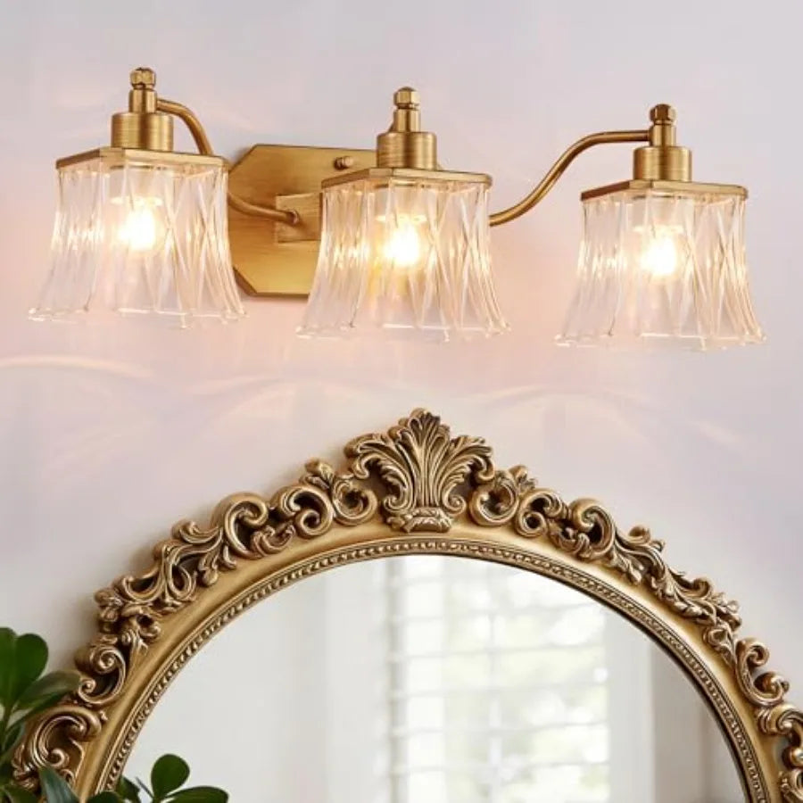 Brushed gold three-light bathroom vanity light with ribbed crystal glass shades