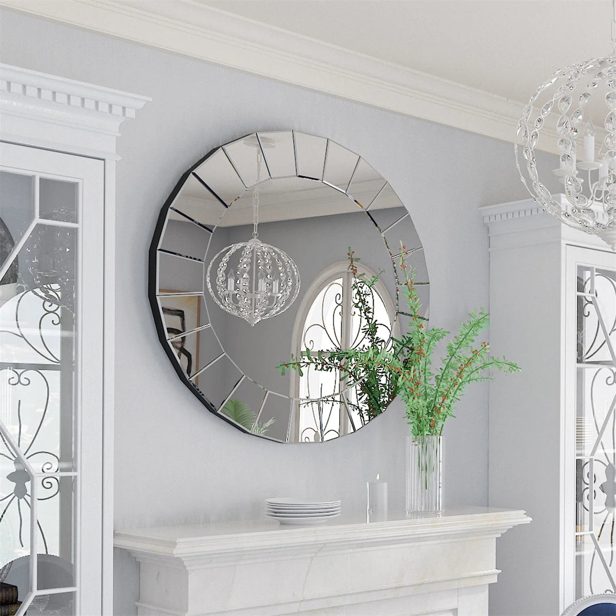 Ornate round Venetian-style mirror with mirrored panel frame above a white mantel
