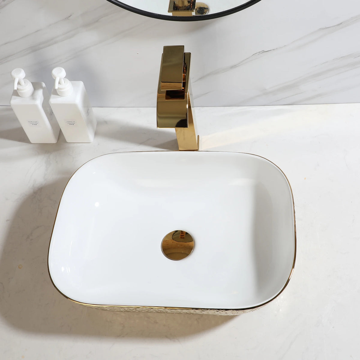 Gold hammered ceramic vessel sink with white basin and gold waterfall faucet