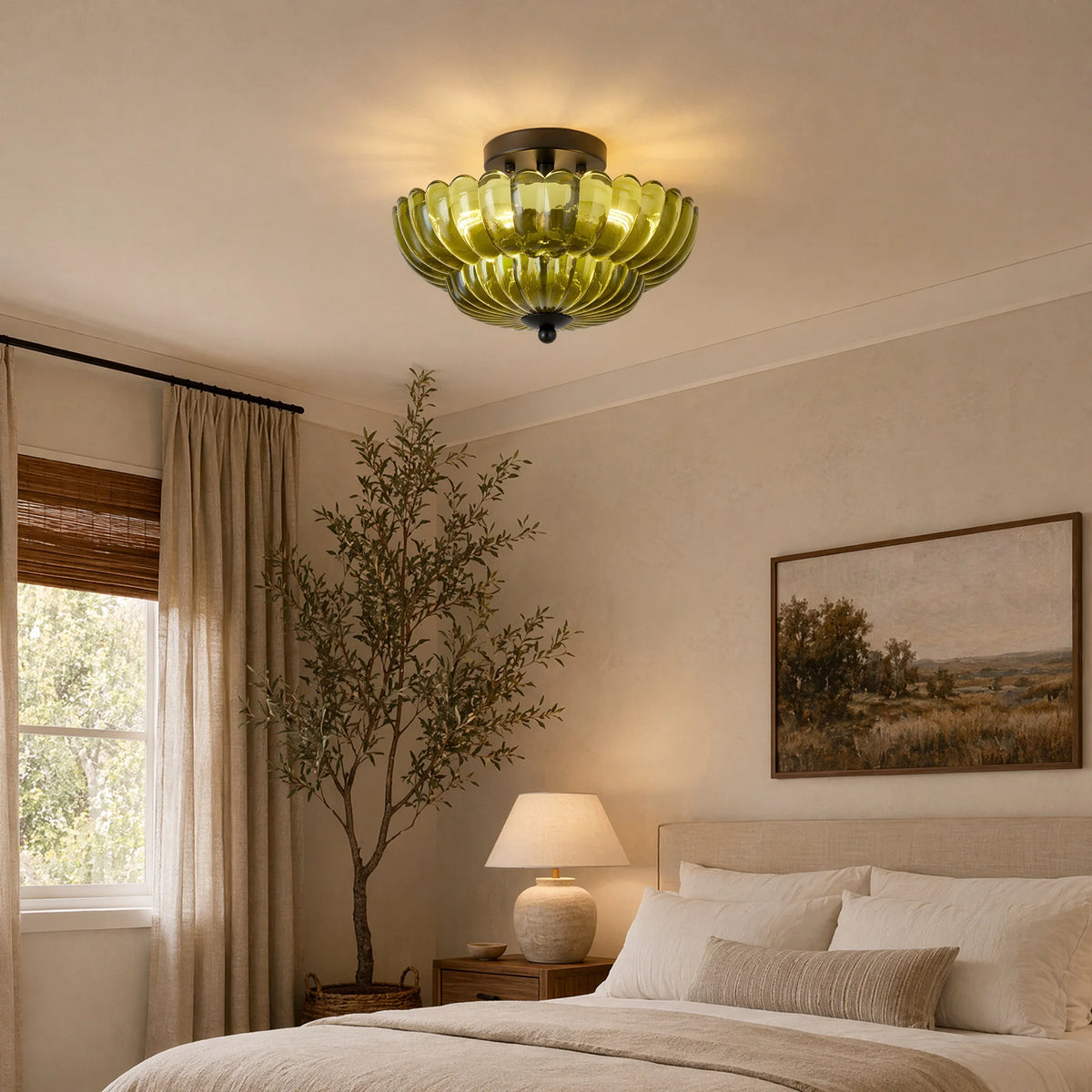 Green petal glass ceiling light glowing in a bedroom