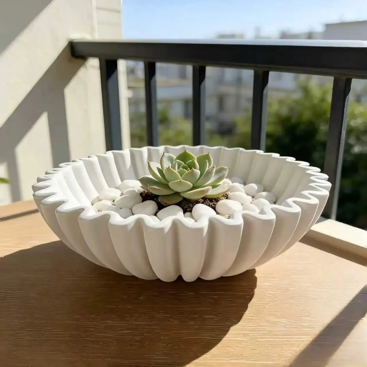 White pleated ceramic bowl with a scalloped rim, top view