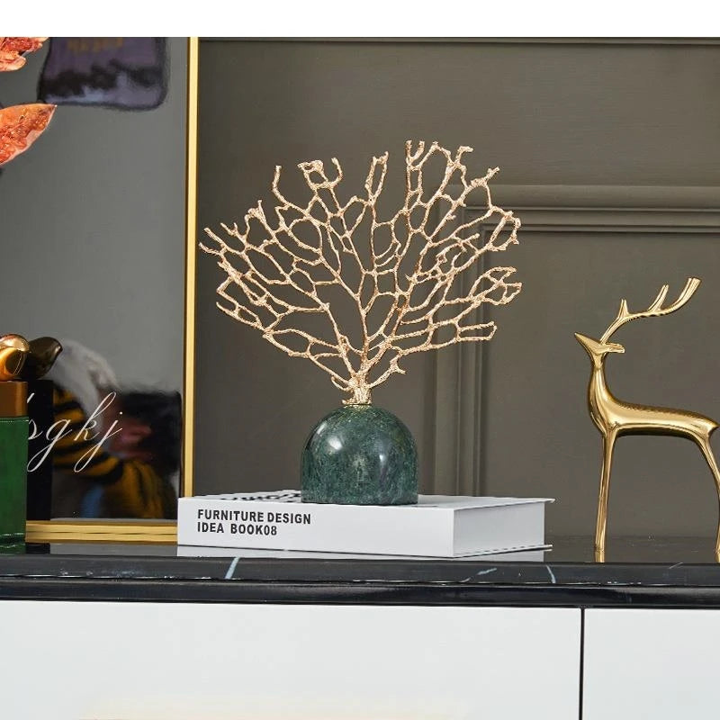 Gold Coral Tree on Marble Base, styled on a console beside a gold deer figurine