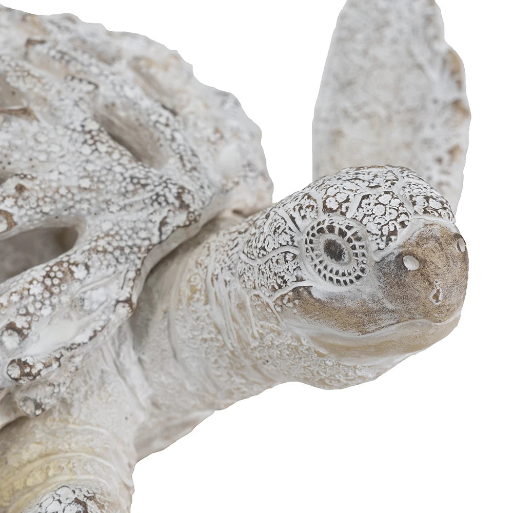 White coral-pattern sea turtle sculpture, close-up of the head