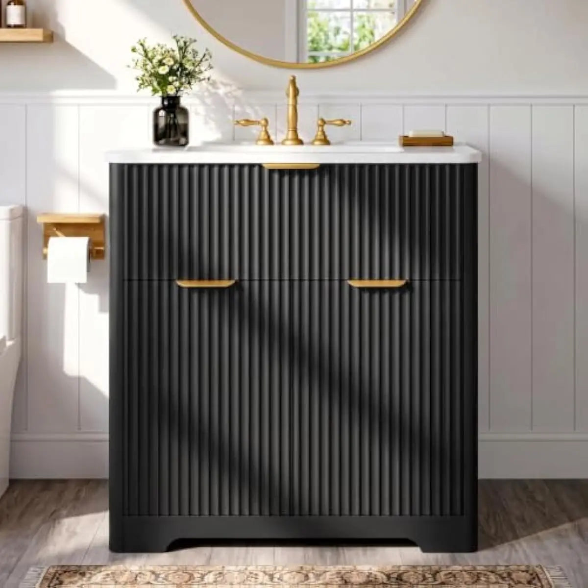 Black fluted vanity with brass faucet under a round mirror