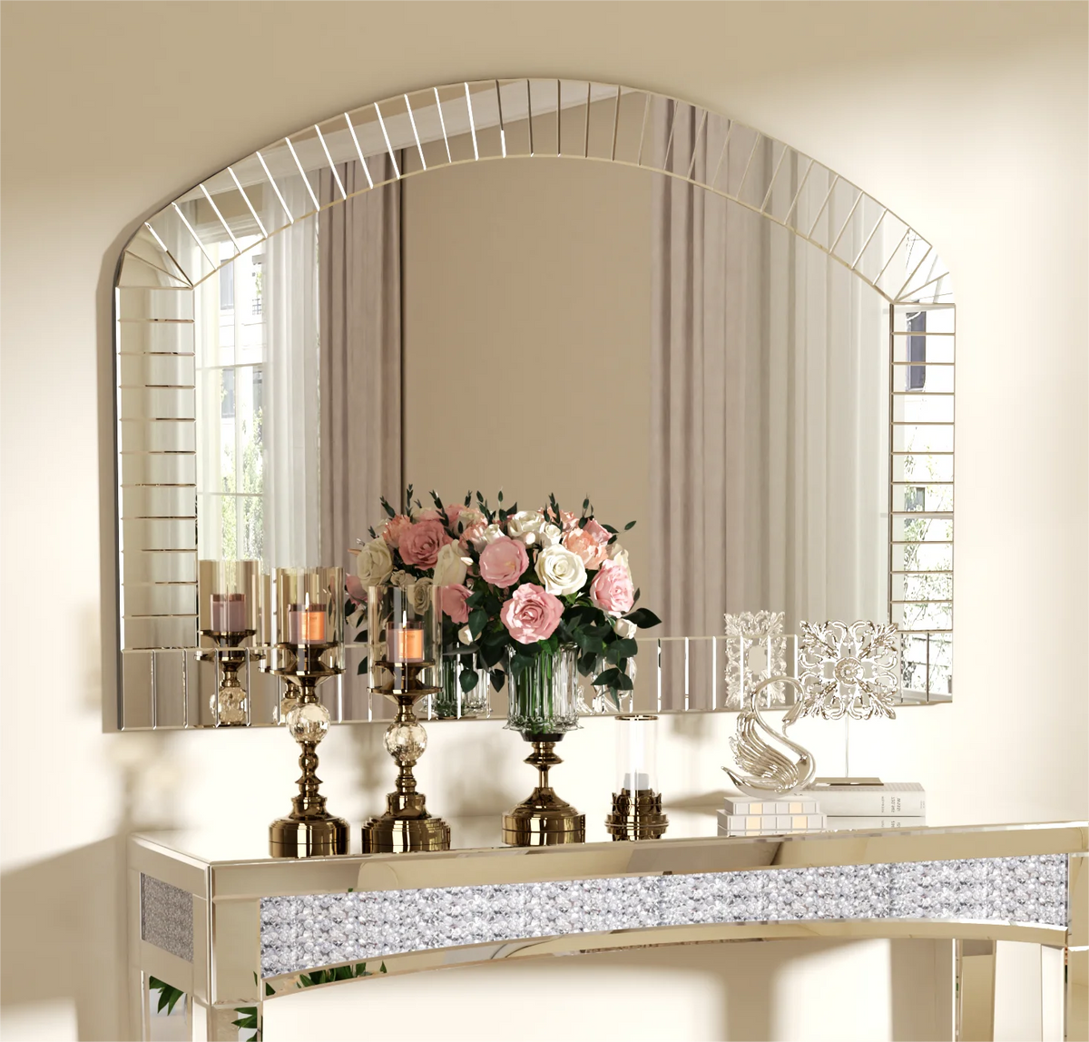 Front view of the arched Venetian glass mirror styled with candlesticks and pink florals