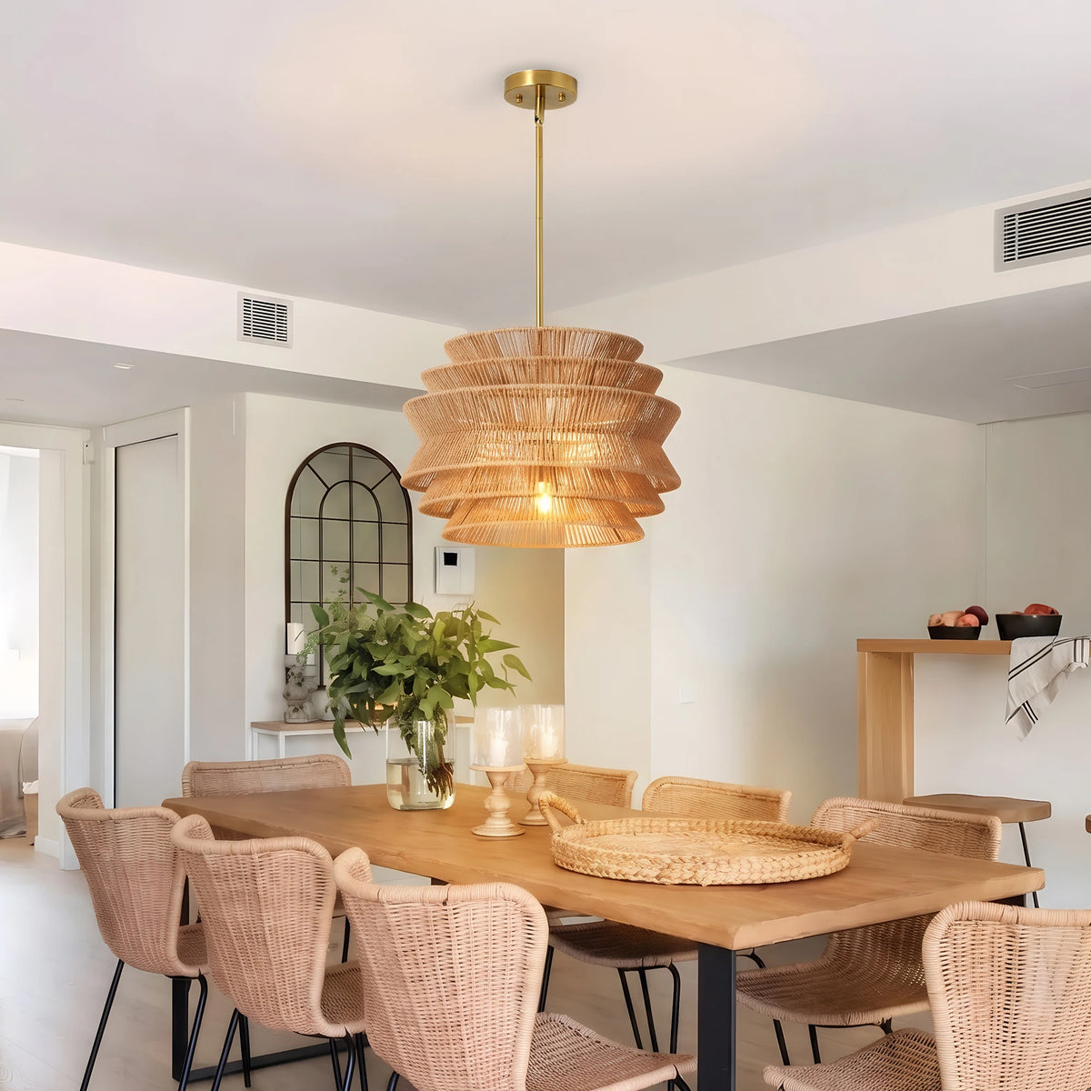 Woven pendant light above a dining room table