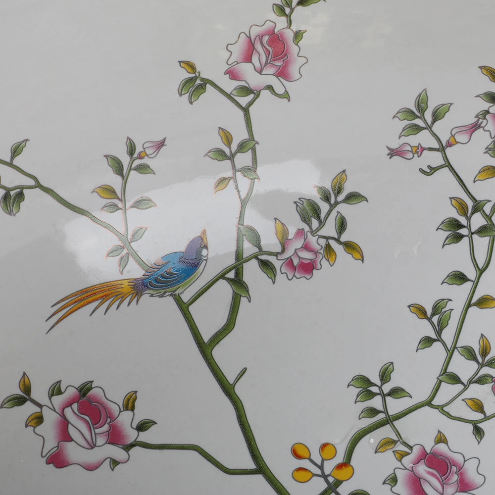 Detail of a bird and blossoms on the white porcelain