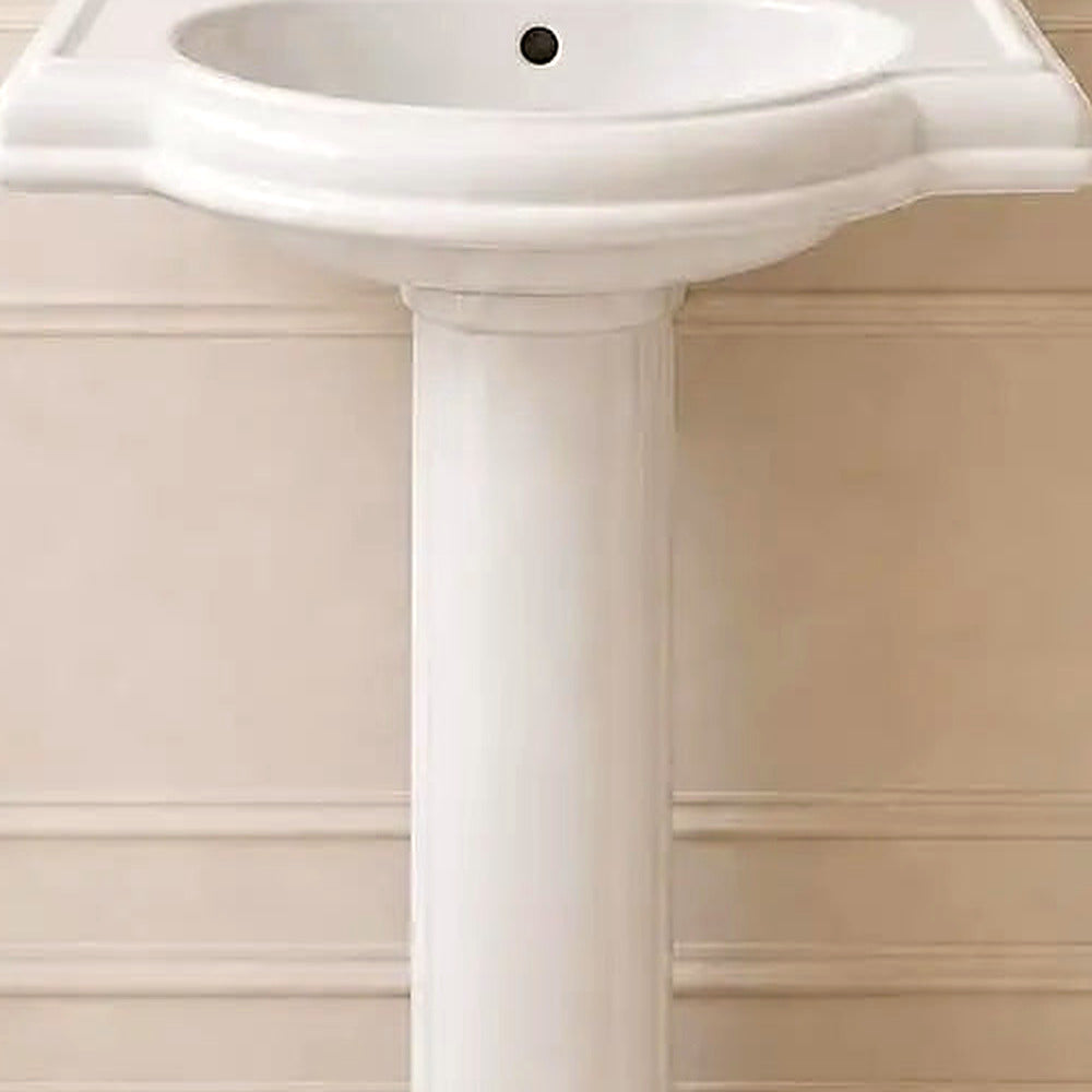 Close-up of the glossy white ceramic basin, its softly curved bowl and gracefully flared rim