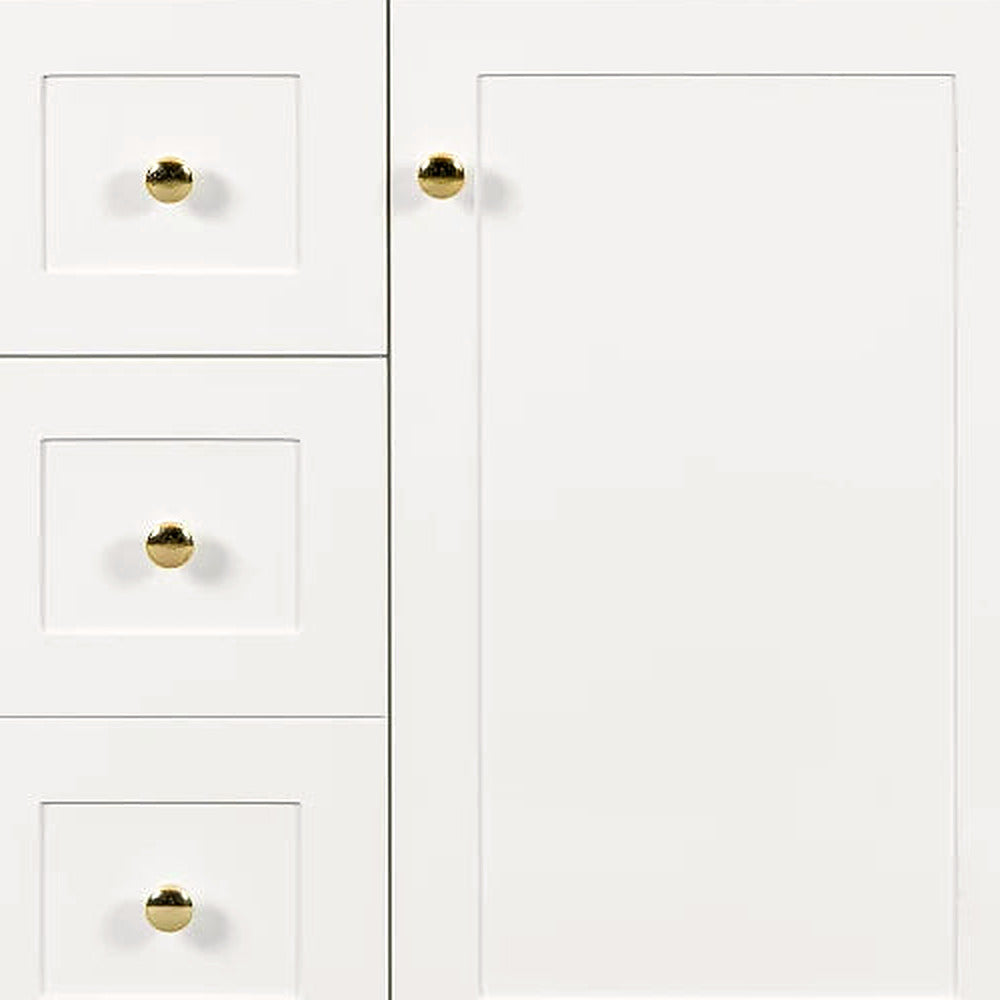 Close-up of the shaker door, drawers and round gold knobs