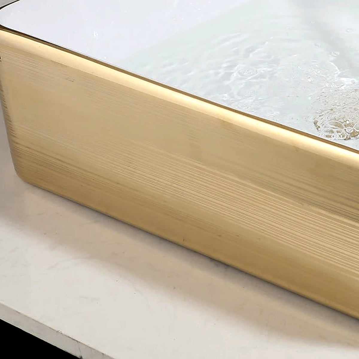 Close-up of the horizontal gold stripe texture on the ceramic vessel exterior