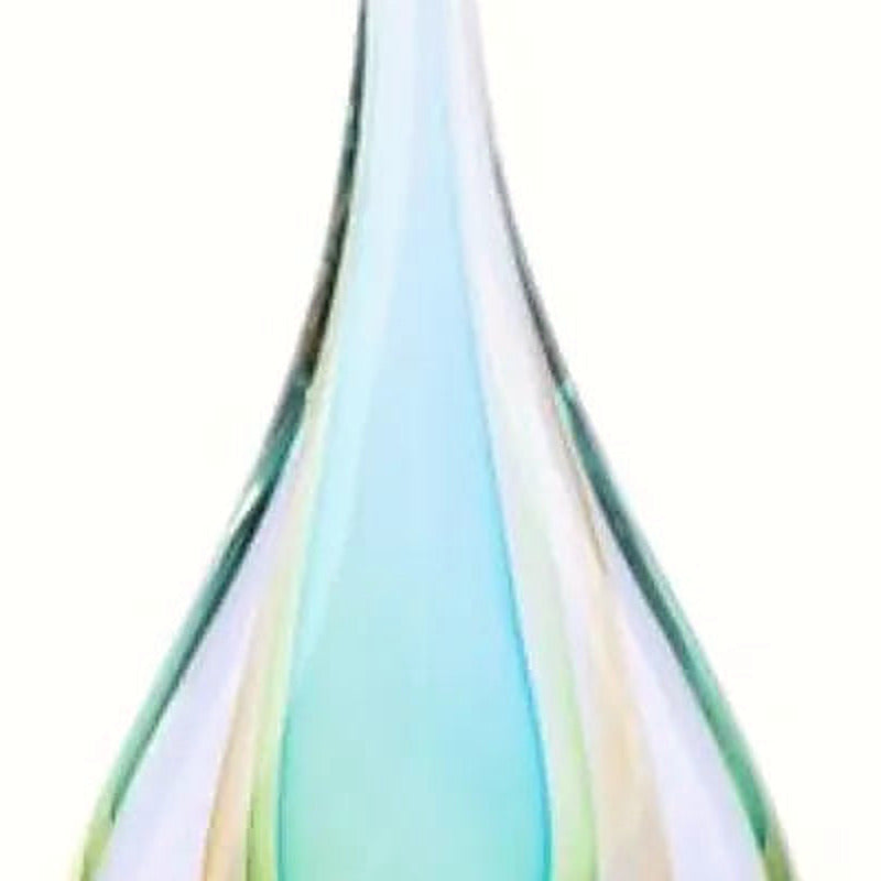 Close-up of the teal and green glass layers inside the clear teardrop