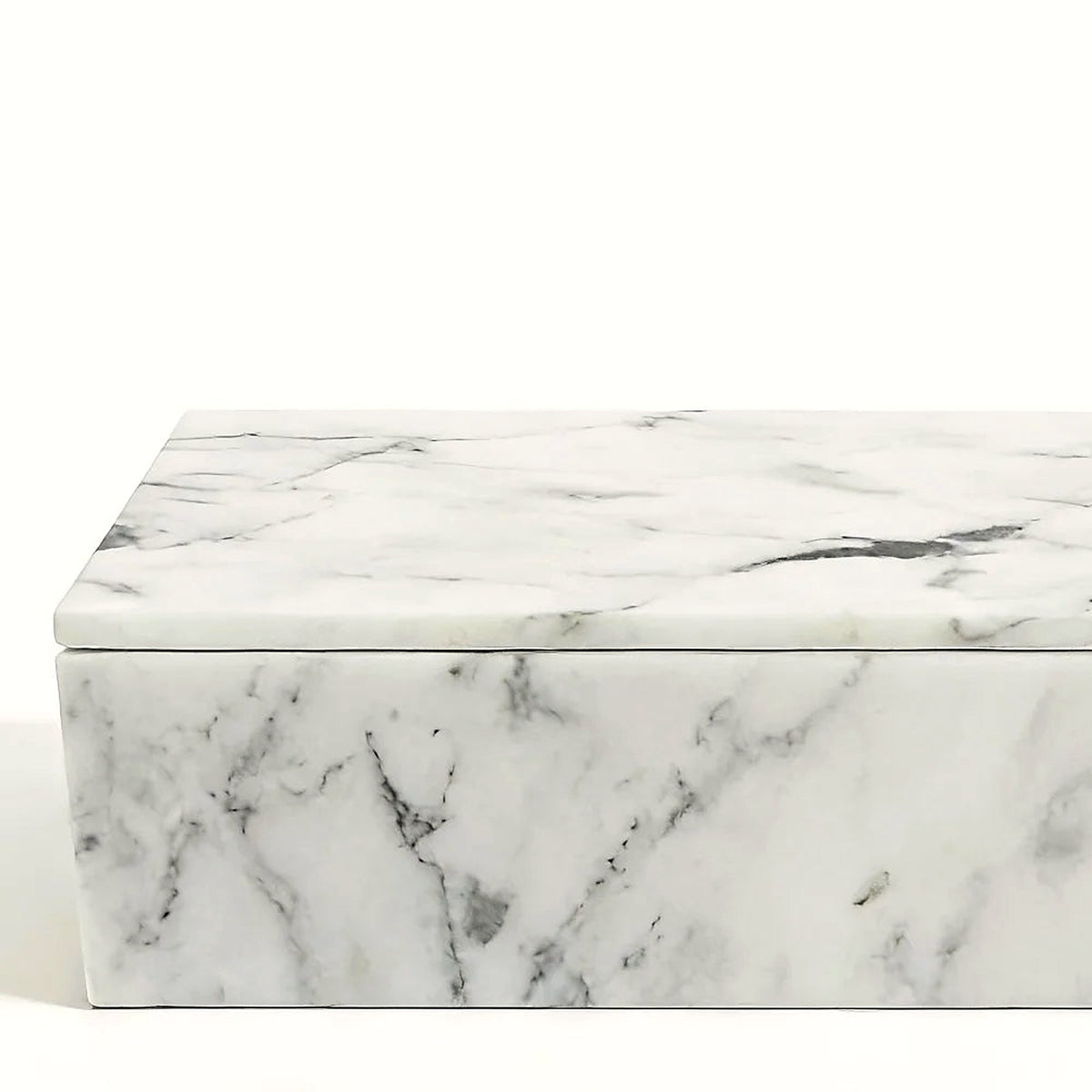 Detail of the polished white marble lid edge and natural grey veins