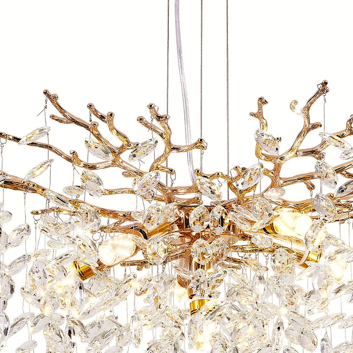 Detail of interlocking gold branches and crystal pendants at the heart of the chandelier