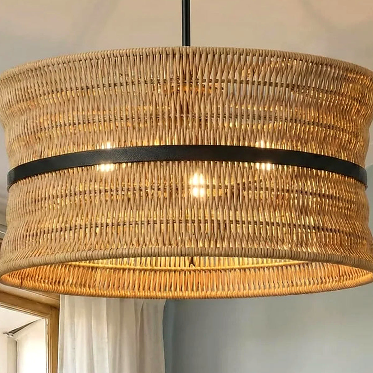Detail of the natural rattan weave texture on the drum pendant