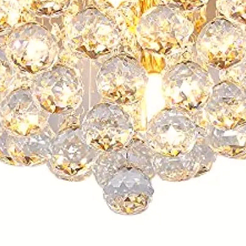 Close-up of the clustered faceted crystal spheres at the base of the fixture