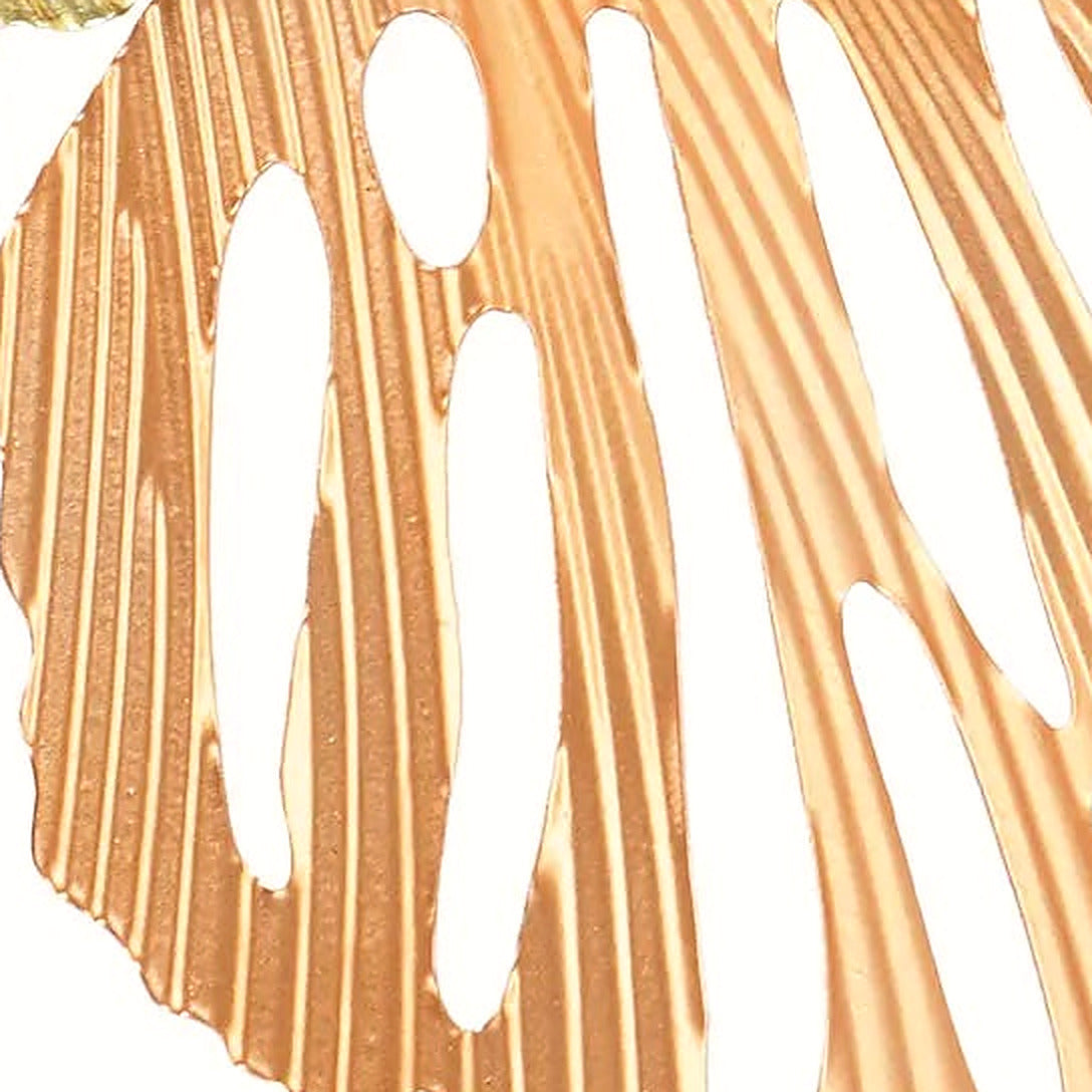 Detail of the ribbed blush metal leaf with elegant cut-out veins