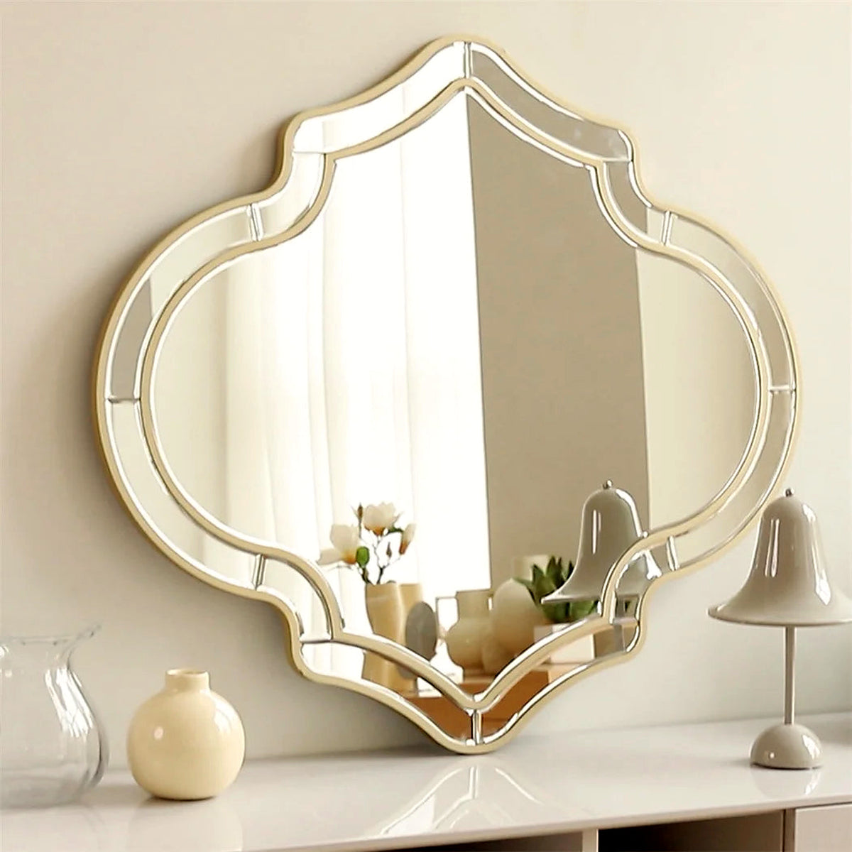 Gold-rimmed quatrefoil wall mirror, 35 x 31 in, with beveled inset border (décor shown for styling)