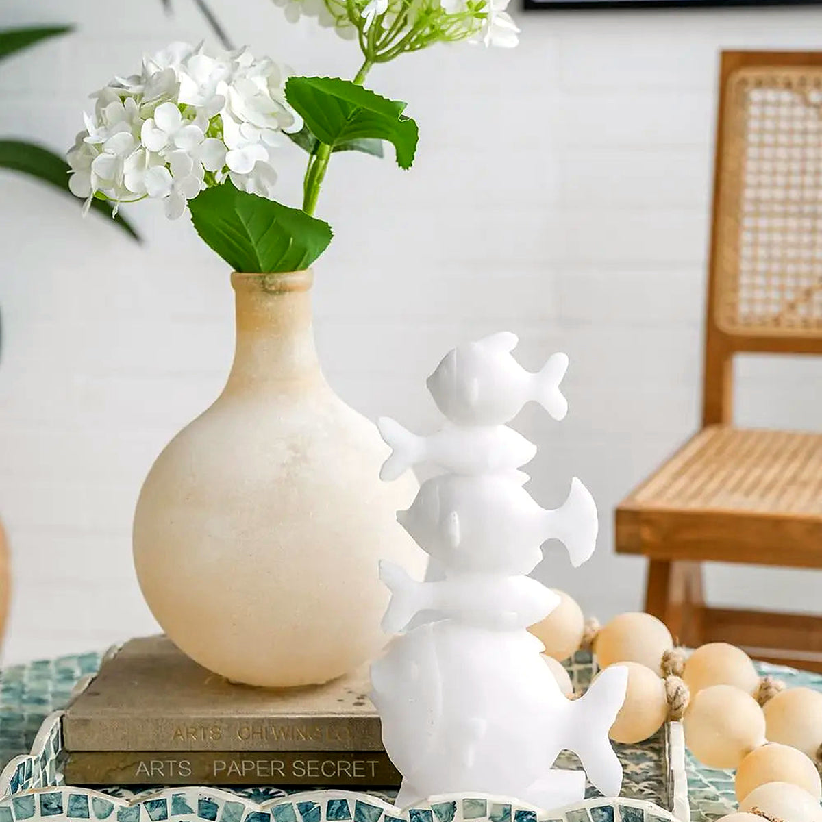 Frosted sand glass bubble vase with white hydrangeas on a teal tray (flowers and décor shown for styling)