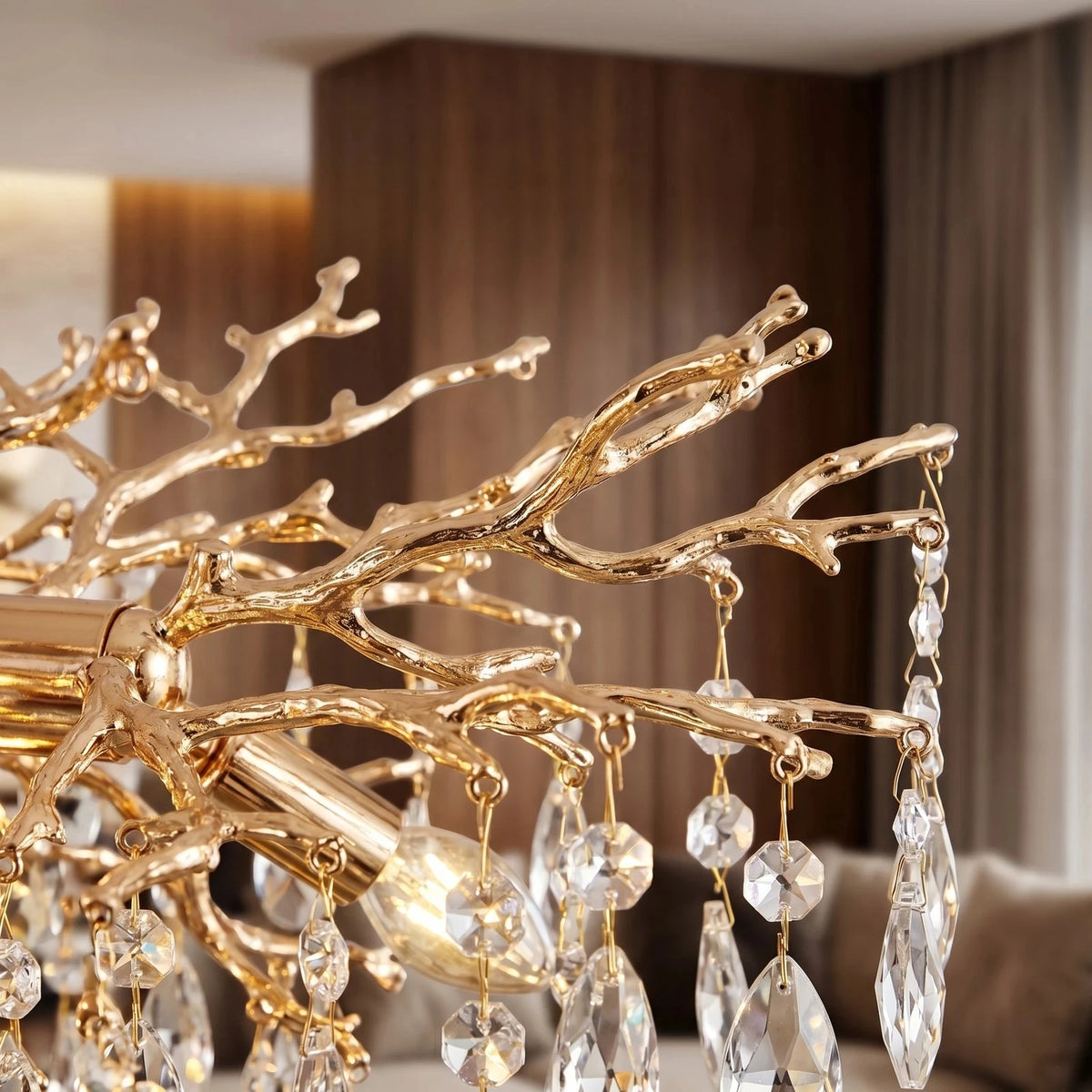 Close-up of gold coral-branch arms hung with K9 crystal drops