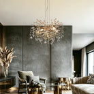Gold crystal branch chandelier lit in a modern living room