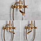Antique brass cross-handle mixer and tub spout running water against a gray tiled wall