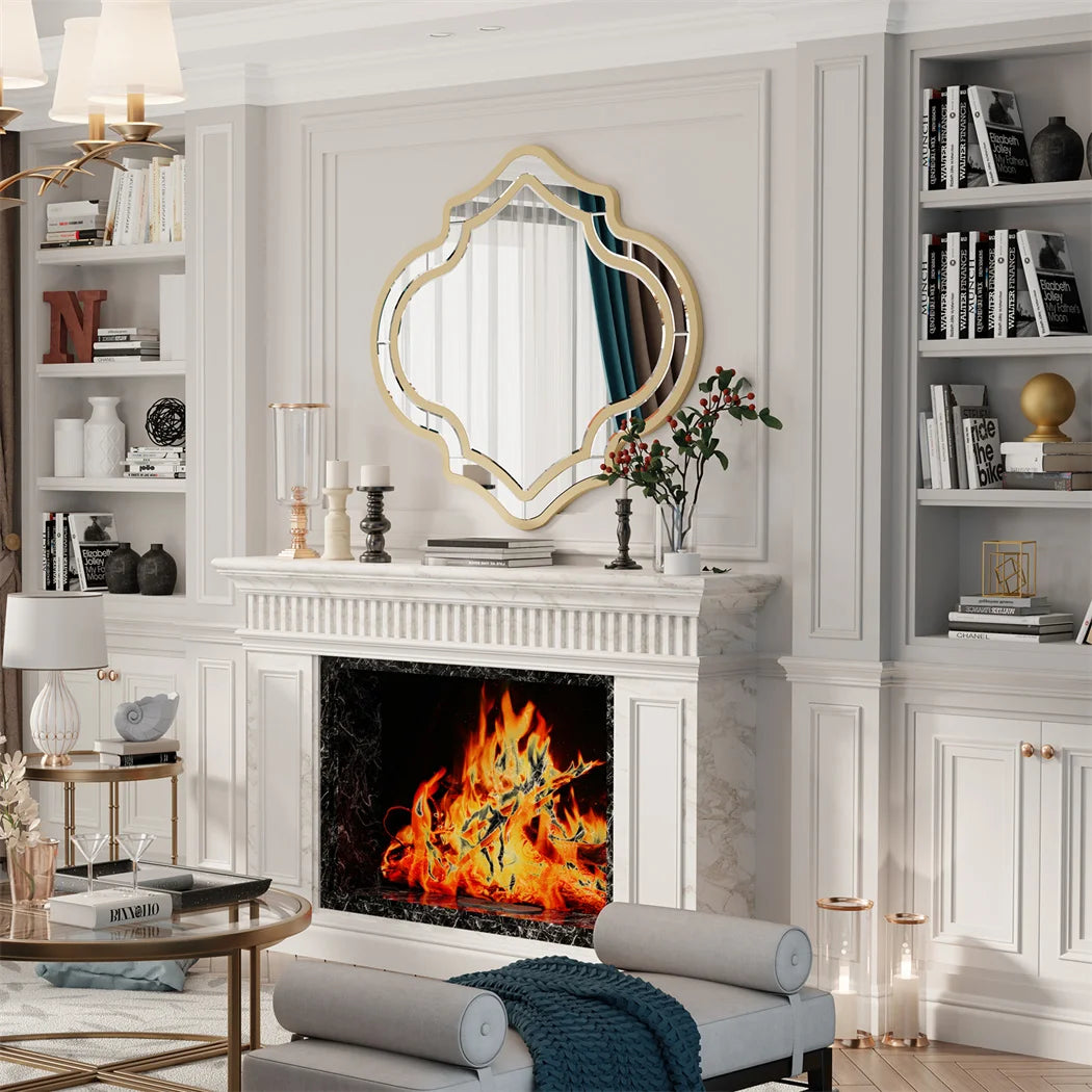 Quatrefoil wall mirror with a slim gold rim in an entryway