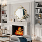 Quatrefoil wall mirror with a slim gold rim in an entryway