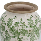 Close-up of the green floral glaze and natural rim