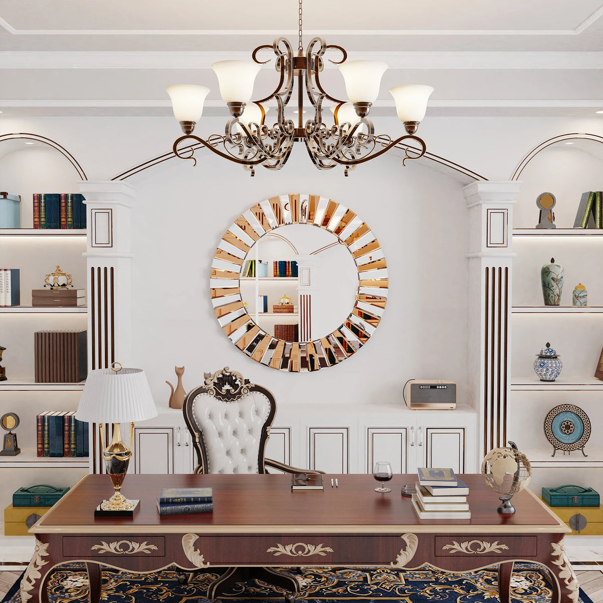 Round starburst wall mirror in a library above a carved desk and chandelier