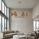 Six-light gold chandelier with woven shades in a living room