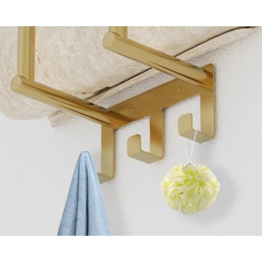 Brushed gold wall towel rack with a top shelf, rolled towels and three hooks (hook detail)