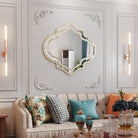 Quatrefoil wall mirror with a slim gold rim, close-up of the rim