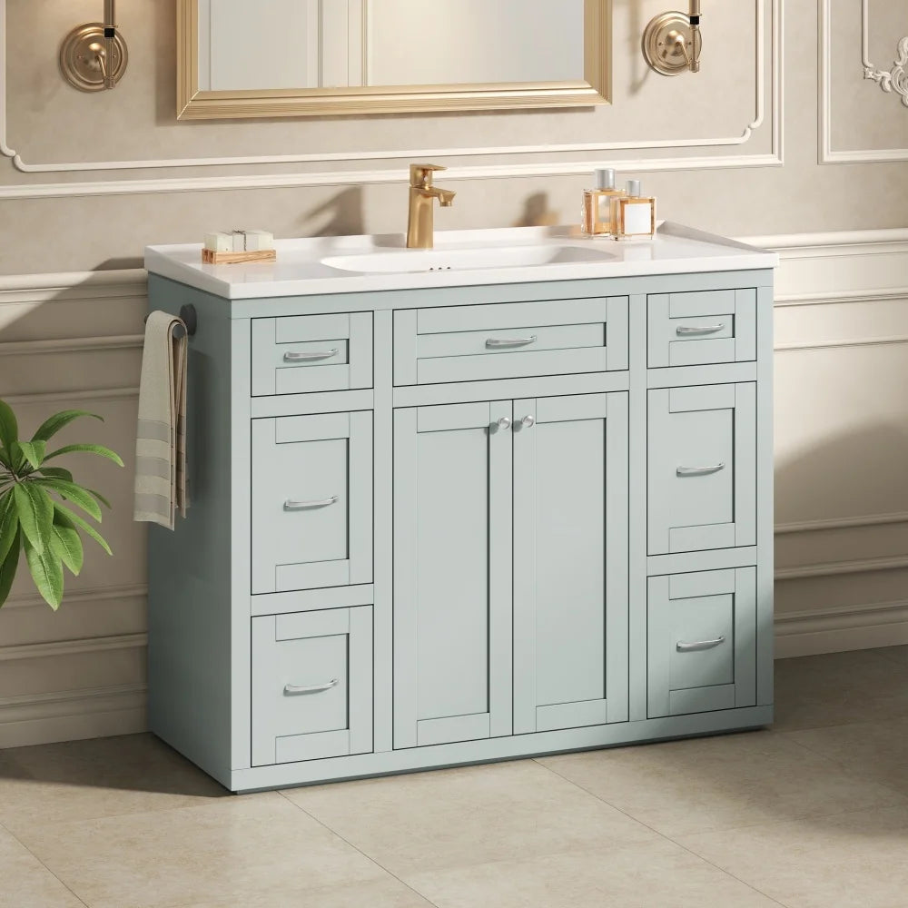 Mint green bathroom vanity with brass faucet in a traditional bath