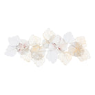 Pink and gold metal flower wall sculpture, soft-focus view of the layered petals