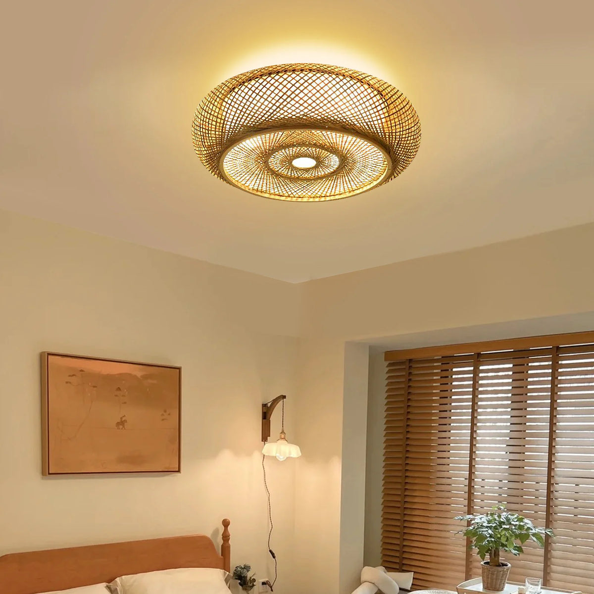 Bamboo drum ceiling light glowing in a living room