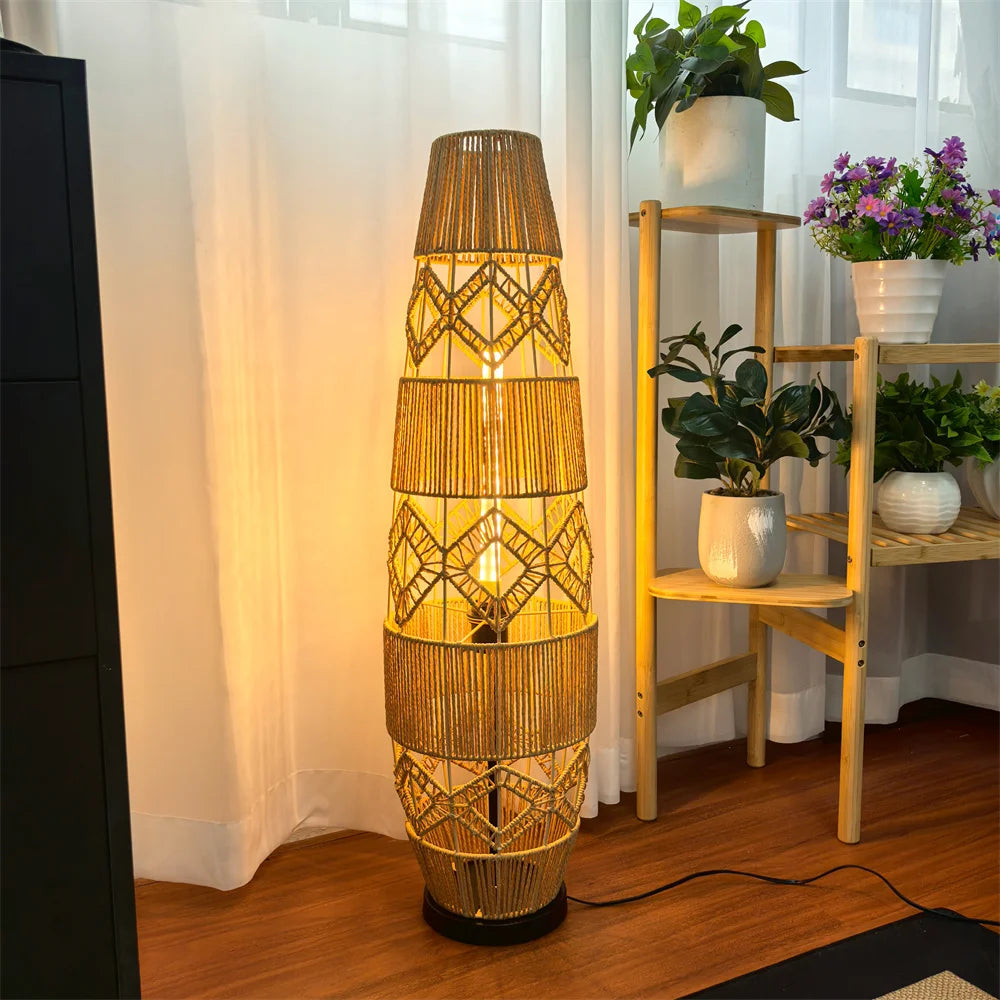 Rattan column floor lamp on a dark base in a living room