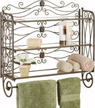 Three-tier antique bronze scrollwork bath shelf with rolled towels