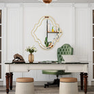 Quatrefoil wall mirror with a slim gold rim in a bedroom