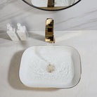 Gold waterfall faucet pouring into a hammered gold vessel sink
