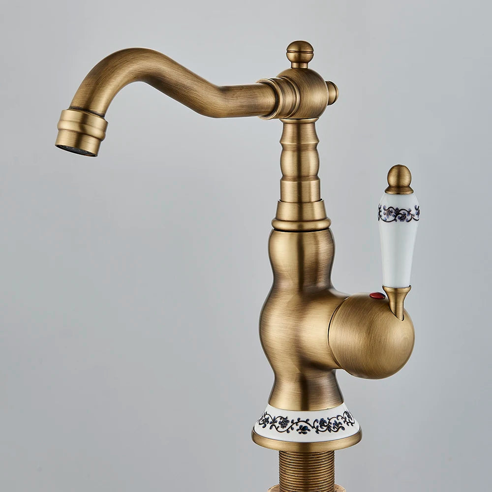 Carved antique brass swivel faucet with single handle
