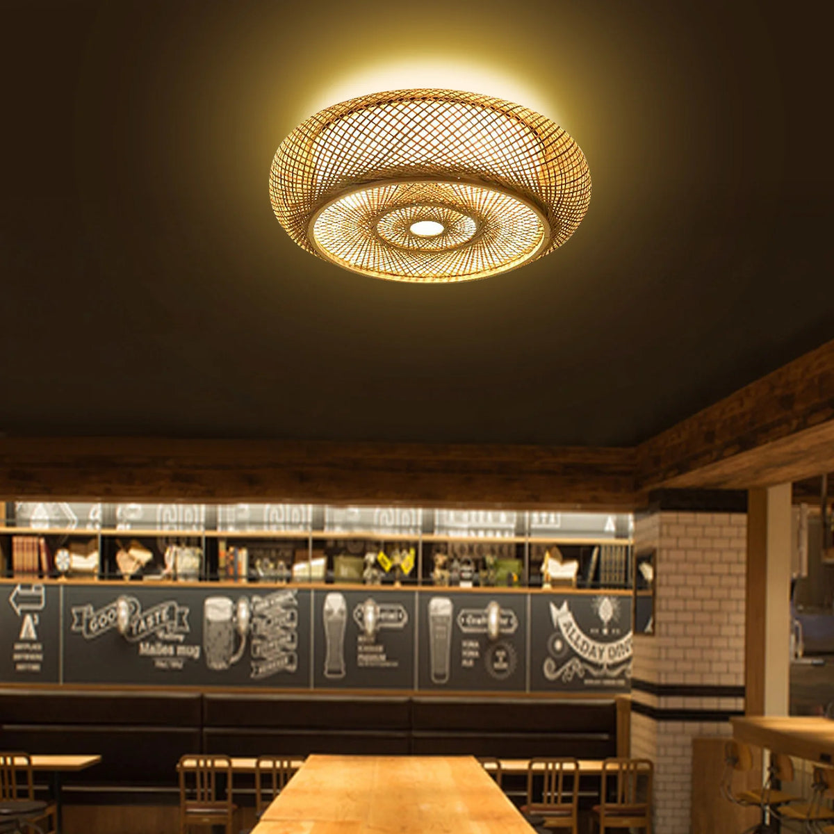 Bamboo drum ceiling light lit above a bar area
