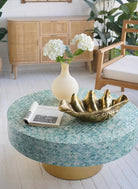 Frosted glass bubble vase with white flowers on a mosaic table